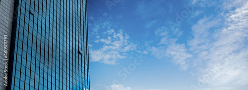 Building windows and cloudy sky, blank space.