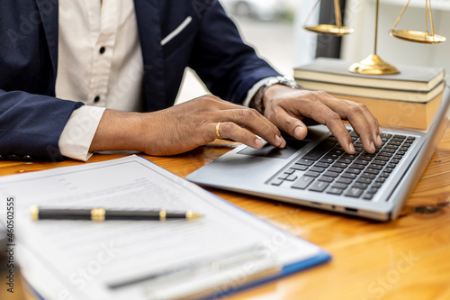 Canvas Print A lawyer man is seeking information on a fraud case to bring to court in a lawsuit from which a client has filed a lawsuit against an employee at a company that commits fraud