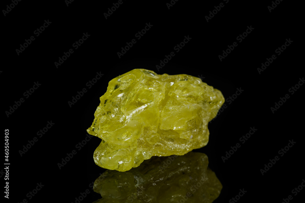 Macro mineral sulfur stone on a black background Macro mineral sulfur stone on a black background