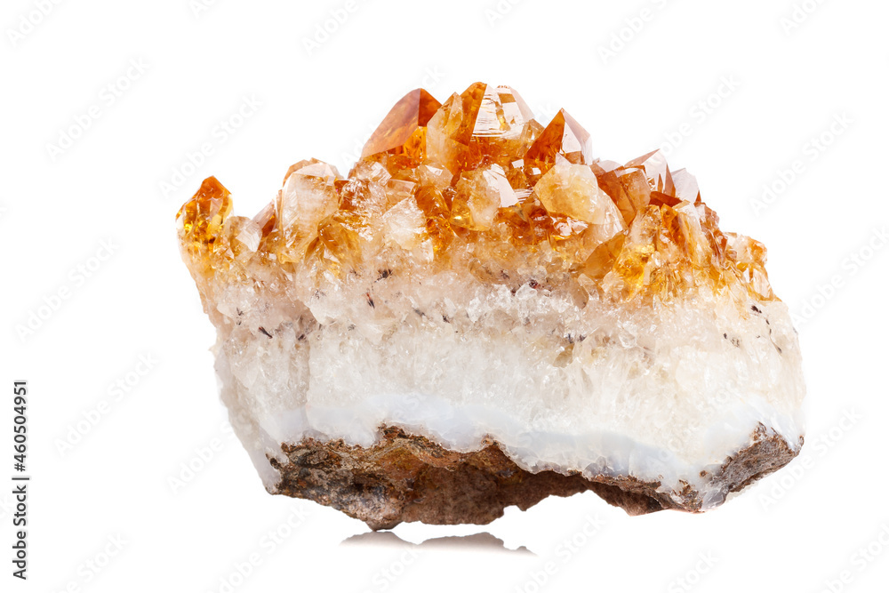 Macro mineral stone Citrine in rock in crystals on a white background Macro mineral stone Citrine in rock in crystals on a white background