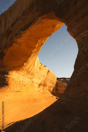 man hikig in arches national park at sunrise in moab utah