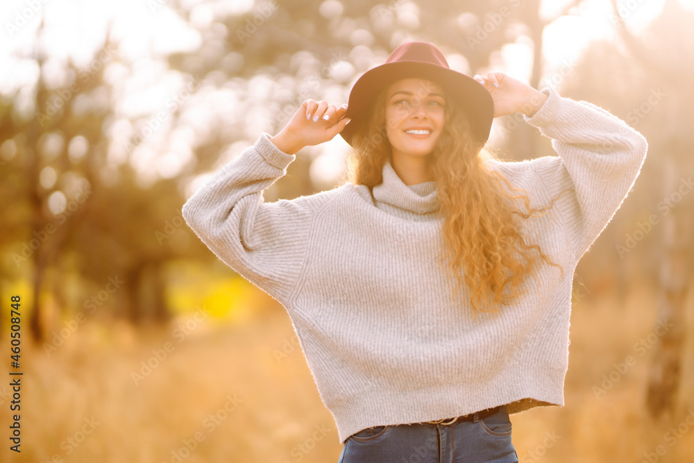 Young woman resting in nature. Fashion, style concept. People, lifestyle, relaxation and vacations concept. Young woman resting in nature. Fashion, style concept. People, lifestyle, relaxation and vacations concept.