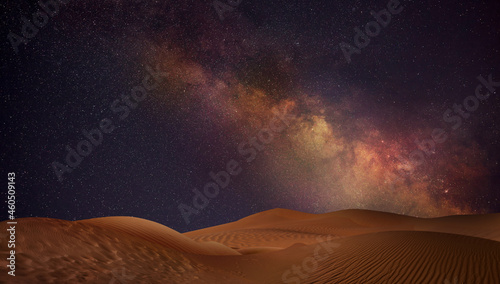 Scenic view of sandy desert under starry sky in night photo