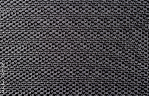 Black synthetic fabric texture, closeup.