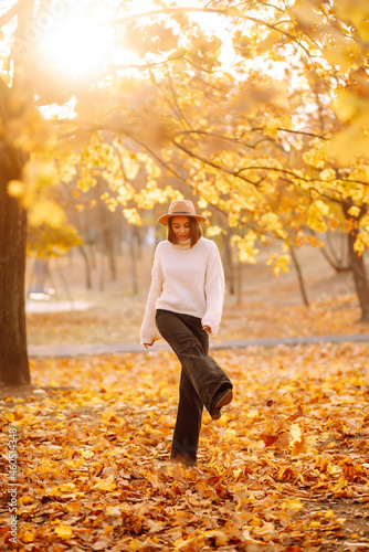 Young woman resting in nature. Fashion, style concept. People, lifestyle, relaxation and vacations concept