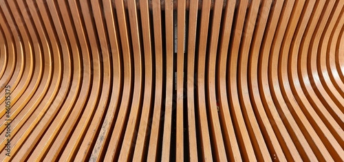 The wooden planks of the bench are light brown.