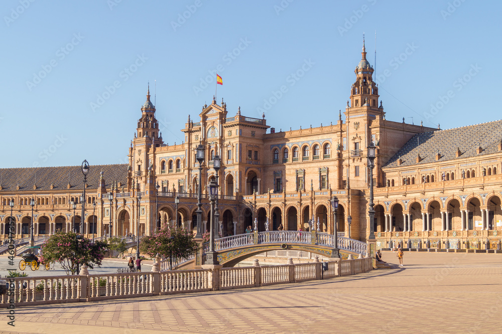 View of the Plaza de España (Spanish Square) in Seville on a sunny morning (Andalusia, Spain). Tourists visiting one of the most emblematic places and architectural work in the city. 