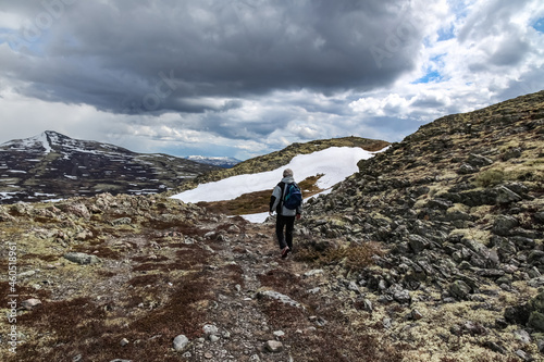 hiker on the top of mountain Rondane, Norway