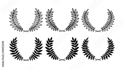 Laurel wreath. Set of outline and silhouette vector hand drawn laurel wreaths isolated on white background. Doodle style. Outline and silhouette floral frames.