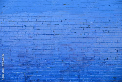 Old Brick wall painted with blue paint.