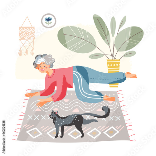 Elderly woman doing healthy sports exercises with cat at home living room interior