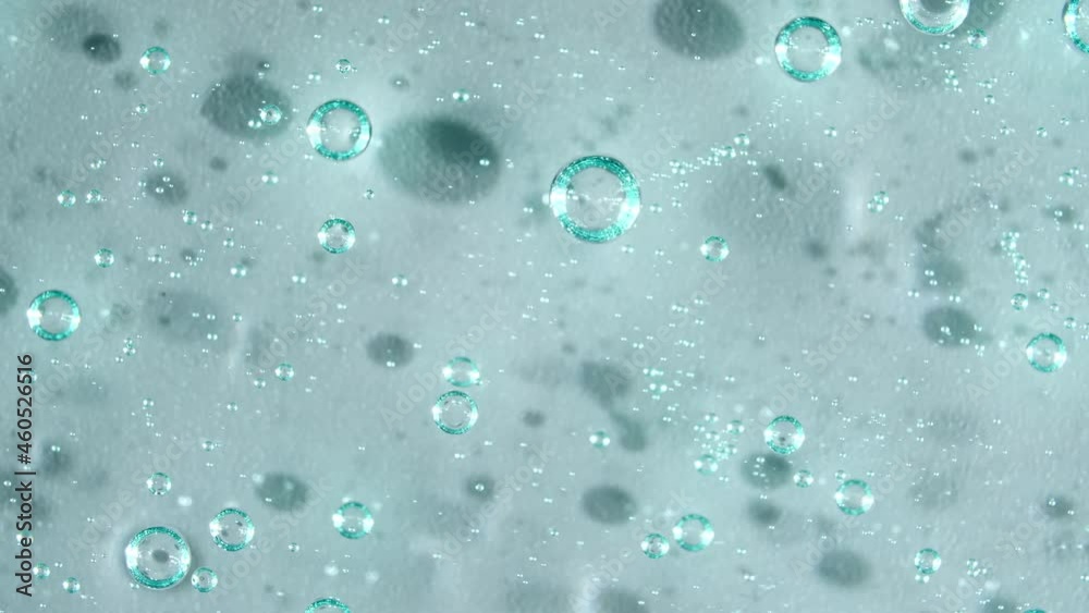 Macro Shot of air Bubbles in Transparent Cosmetic Liquid Gel Cream. Blue Cosmetic Fluid texture With Bubbles. Slow motion . High quality 4k footage Macro Shot of air Bubbles in Transparent Cosmetic Liquid Gel Cream. Blue Cosmetic Fluid texture With Bubbles. Slow motion . High quality 4k footage