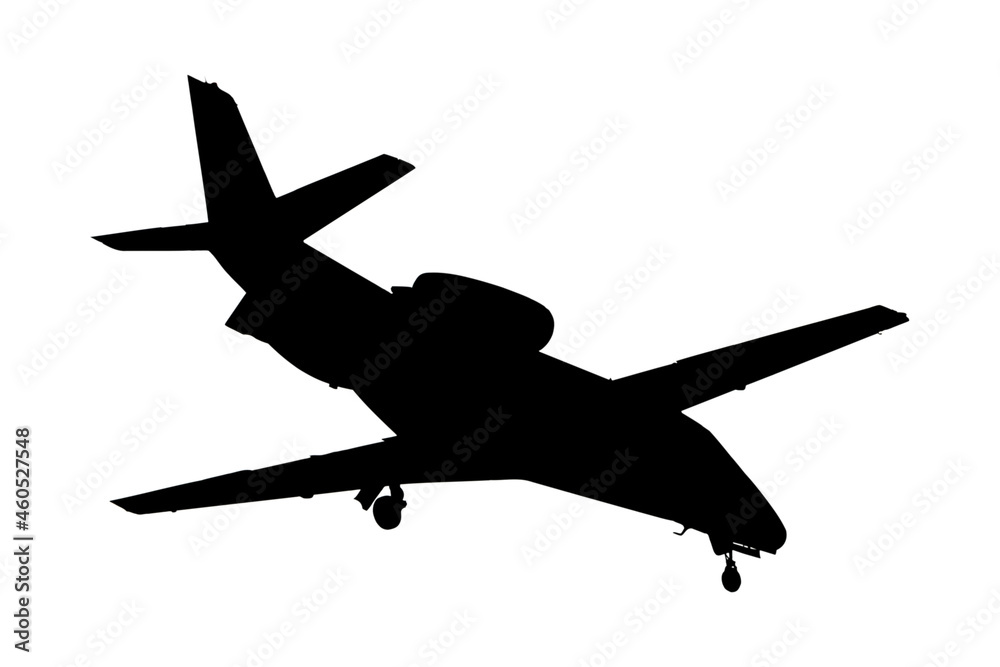 Silhouette of business airplane landing Silhouette of business airplane landing