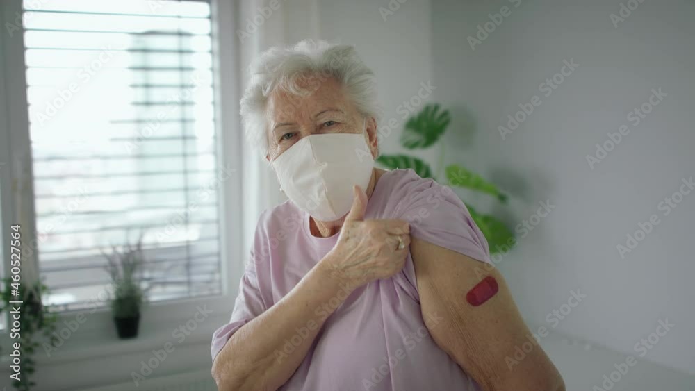 Senior woman showing plaster on arm indoors, covid-19 vaccination concept. Senior woman showing plaster on arm indoors, covid-19 vaccination concept.