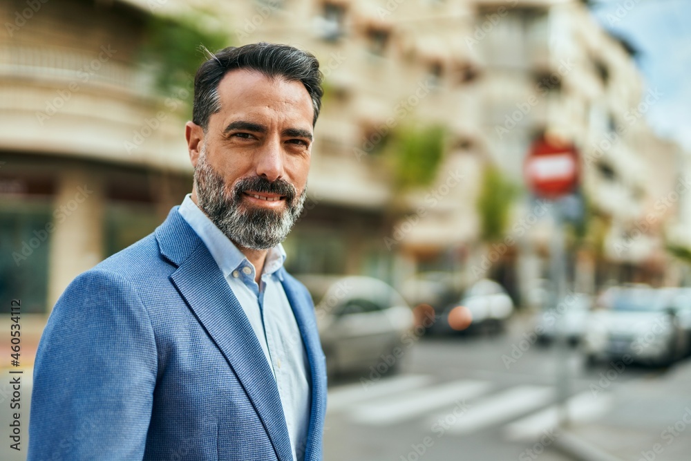 Middle age businessman smiling happy standing at the city. Middle age businessman smiling happy standing at the city.