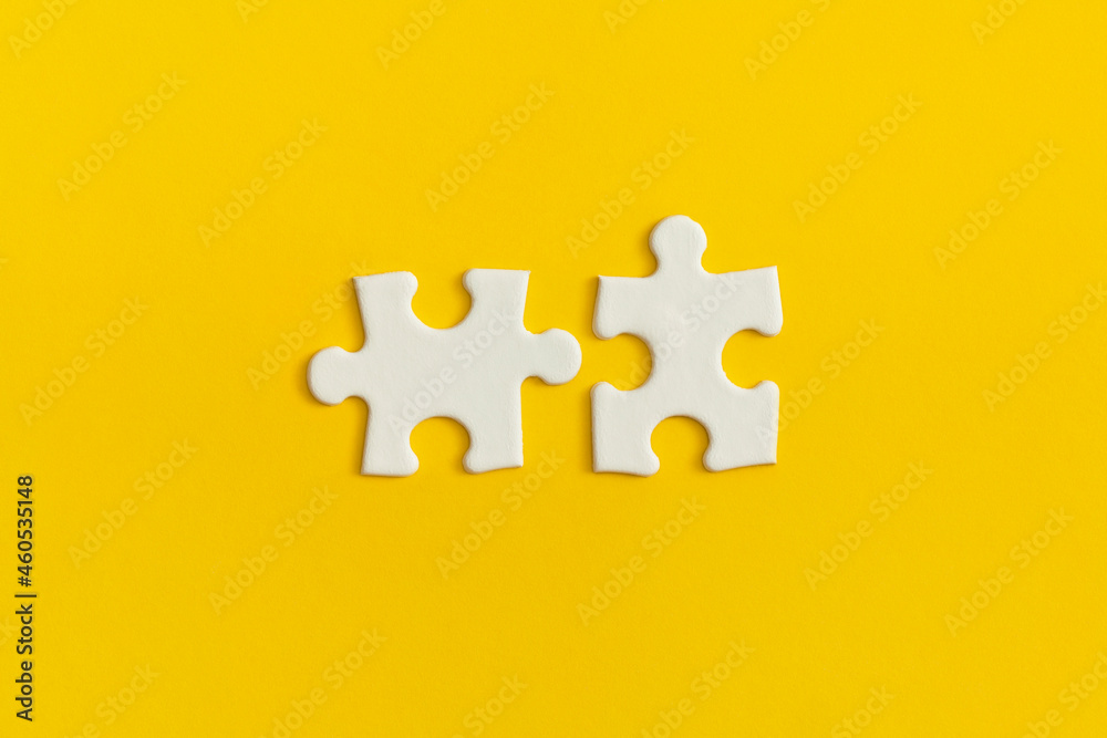 White details of puzzle on yellow background.
