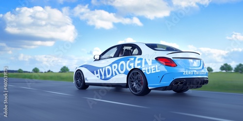 Hydrogen vehicle driving on a green road.