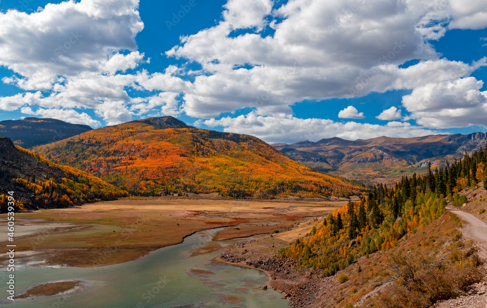 Rocky Mountain Landscape With River At Fall Time