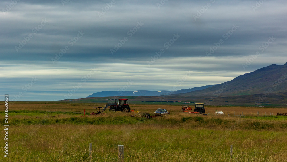 summer road trip on an open high way in Route 1 in Iceland with dramatic mountain landscape on the background.