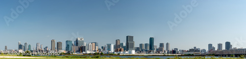 Panoramic view of office buildings of central Osaka city from Yodogawa river bank