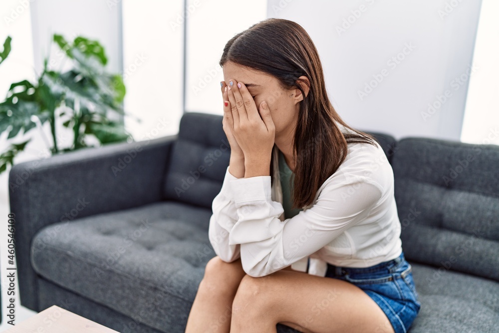 Young hispanic woman stressed having psychology treatment at pshychiatry clinic Young hispanic woman stressed having psychology treatment at pshychiatry clinic
