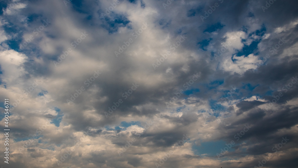 Dramatic panorama with white clouds and blue sky