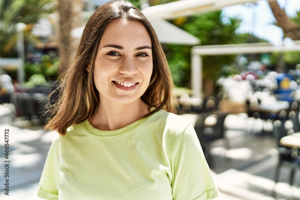 Young beautiful woman smiling happy outdoors on a sunny day of summer Young beautiful woman smiling happy outdoors on a sunny day of summer