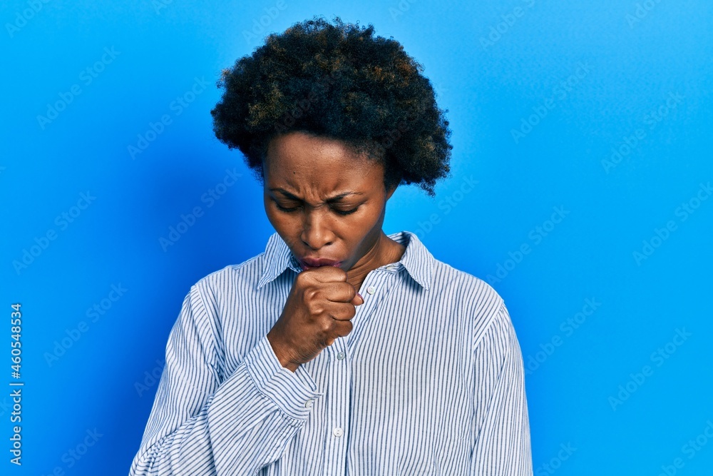 Young african american woman wearing casual clothes feeling unwell and coughing as symptom for cold or bronchitis. health care concept. Young african american woman wearing casual clothes feeling unwell and coughing as symptom for cold or bronchitis. health care concept.