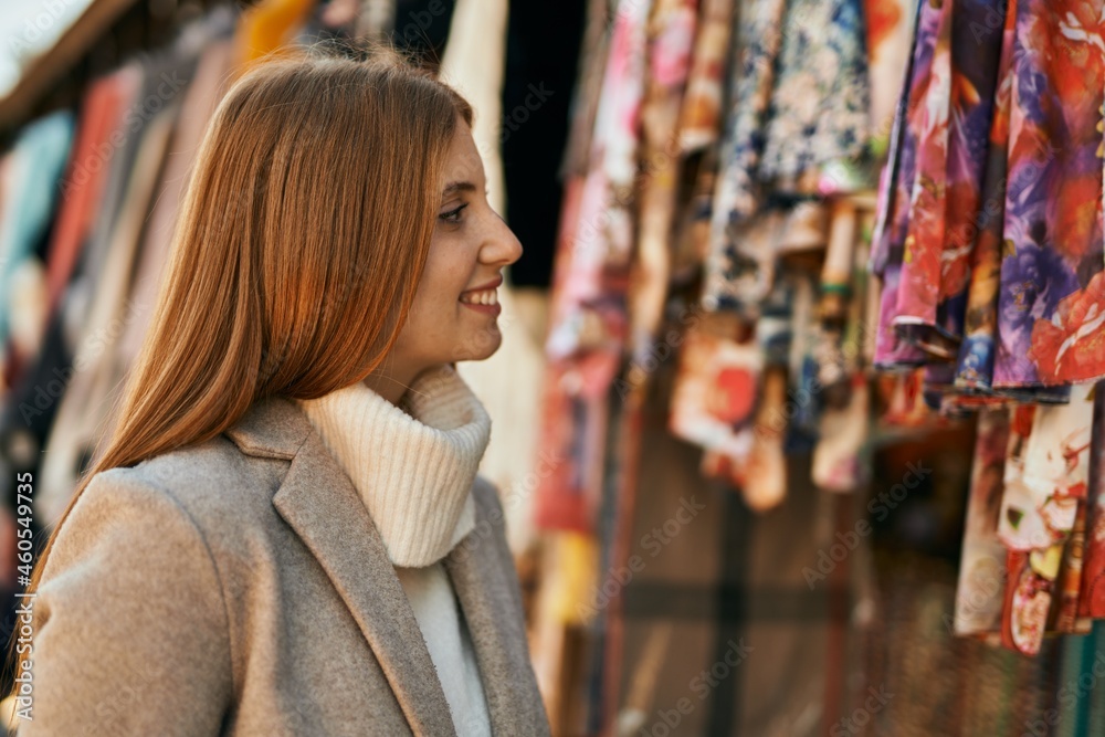 Young redhead girl smiling happy standing at the city. Young redhead girl smiling happy standing at the city.