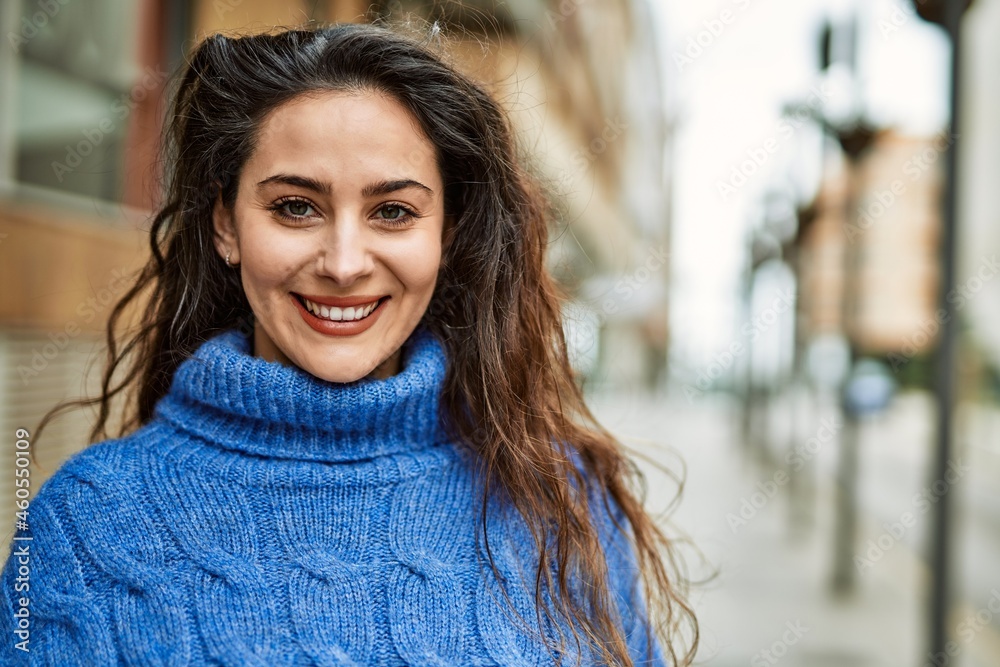 Young hispanic woman smiling happy standing at the city. Young hispanic woman smiling happy standing at the city.