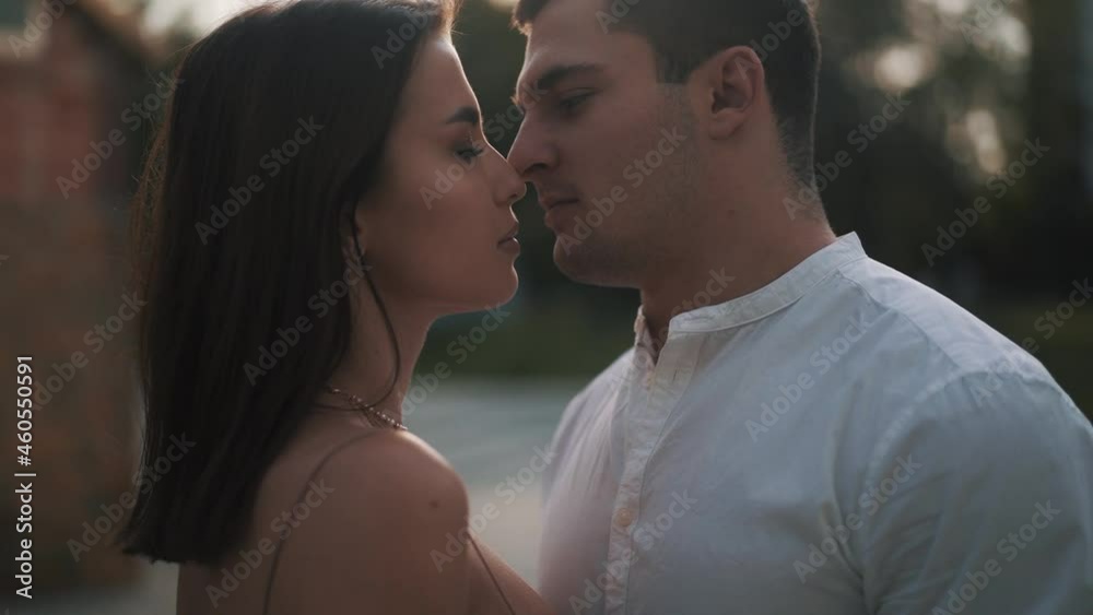 Attractive couple flirting and ready to kiss. Slowmotion close up video. Man and woman stay in front of each other and want to kiss but just looking. Love concept. High quality FullHD footage Attractive couple flirting and ready to kiss. Slowmotion close up video. Man and woman stay in front of each other and want to kiss but just looking. Love concept. High quality FullHD footage