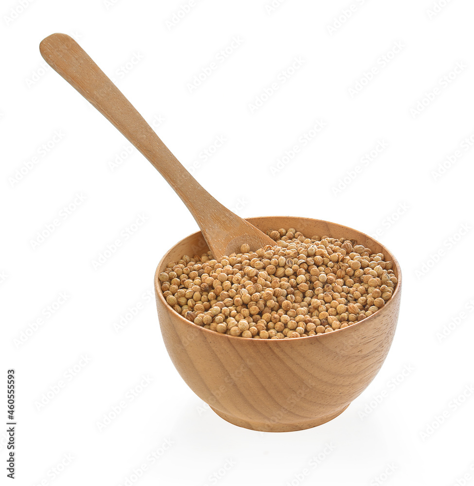 coriander seeds in wood bowl on white background coriander seeds in wood bowl on white background