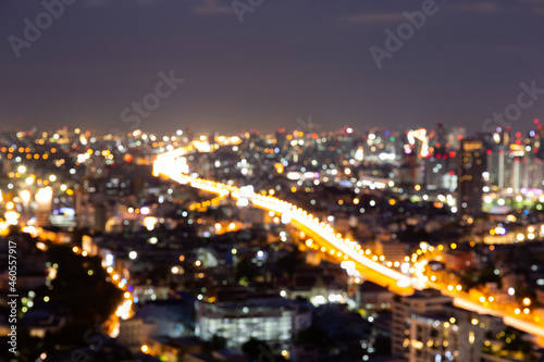 Blur bokeh background with cityscape in twilight  blurred focus in evening with downtown  landscape  illuminated and light.