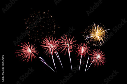 Many flashing colorful fireworks in event amazing with black background celebrate New Year  holiday and festival in night.