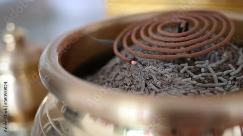 Sandalwood incense coil are burn as part of the offering in the religion of Buddhism. photo