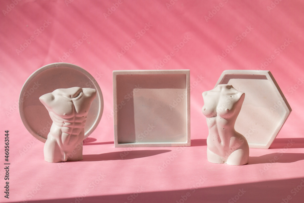 Minimal abstraction with geometric shapes, square, circle of plaster of concrete. Abstract background. Two figures of a man and a woman. Modern decoration Minimal abstraction with geometric shapes, square, circle of plaster of concrete. Abstract background. Two figures of a man and a woman. Modern decoration