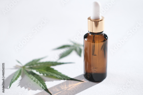 Medical Marijuana Cannabis Cbd Oil in amber glass bottle with dropper. THC tincture and hemp leaves, Herbal Treatment, Alternative Medicine. for calmness and tranquility