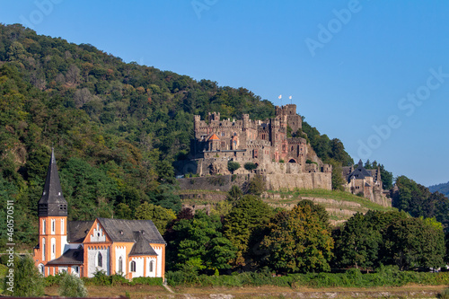Reichenstein Castle on the upper middle Rhine River near Trechtingshausen  Germany  with view of St. Clement   s Chapel in the foreground