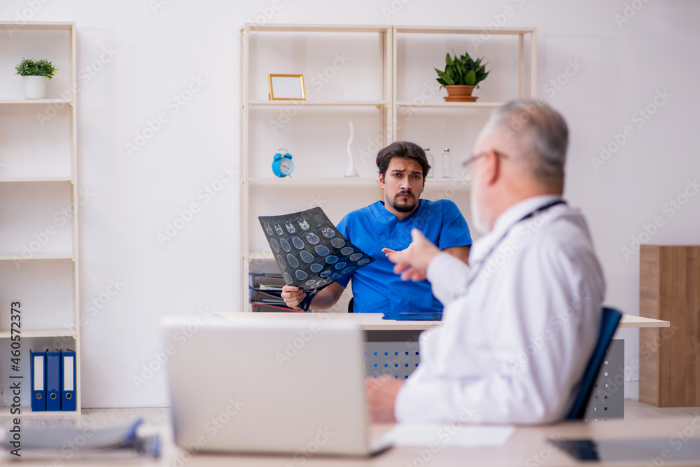 Two male doctors working in the clinic