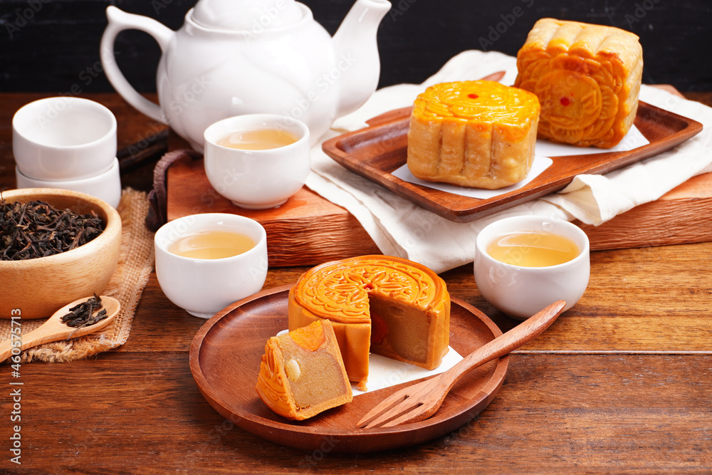 Mooncakes Stir Fried Durian Filling with Salted Egg Yolk and hot tea Asian Festival
