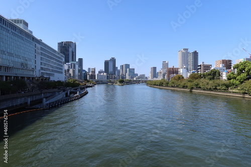 A cirtscape of Osaka in Japan                                     Oka-wa River flowing through Osaka and a distant view of Tenjin-bashi Bridge                                                 