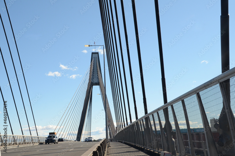 Fototapeta premium Anzac Bridge – an eight-lane cable-stayed bridge that spans from Pyrmont to Glebe Island over Johnstons Bay in Sydney Australia. Taken from the pedestrian footpath on the bridge.