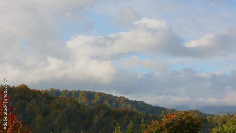 timelapse of an autumn forest with a beautiful sky. clouds pass over the forest in the mountains. autumn in the mountains timelapse of an autumn forest with a beautiful sky. clouds pass over the forest in the mountains. autumn in the mountains