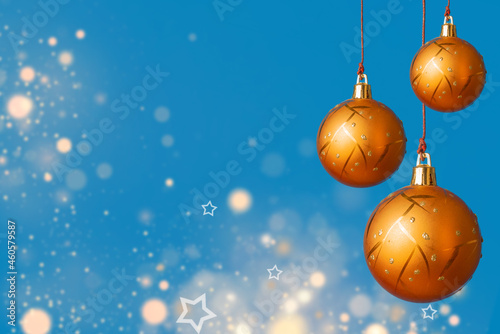 Beaufitul and elegant Christmas background with orange christmas balls on a blue background with diffuse lights