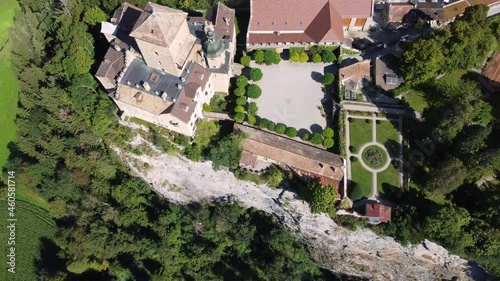 Aerial drone footage of the Ortenstein castle on a hilltop near Thusis in Canton Graubunden in the alps in Switzerland. Shot with an downward and tilt up motion photo