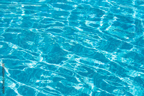 Pool water background, blue wave abstract or rippled water texture background.