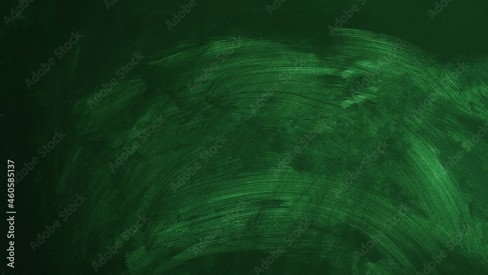 Empty green chalkboard. School board with traces of chalk Empty green chalkboard. School board with traces of chalk