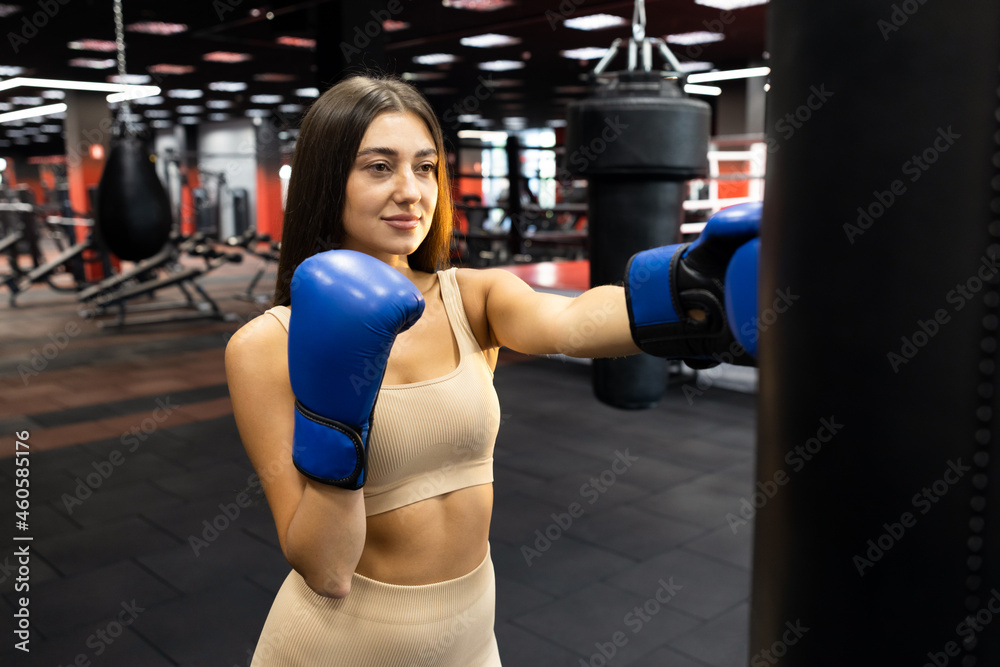 Woman practicing with punching bag