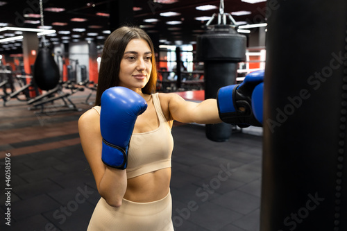 Woman practicing with punching bag