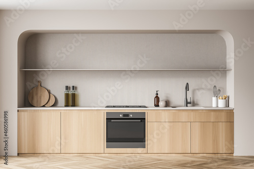 Modern beige kitchen with niche
